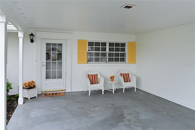 property entrance with a patio area