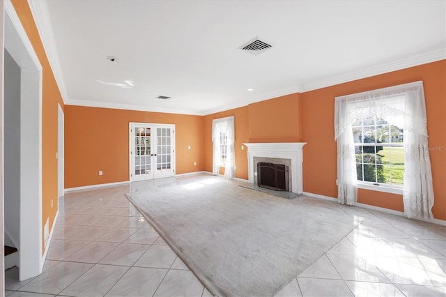 unfurnished living room with baseboards, visible vents, crown molding, french doors, and a high end fireplace