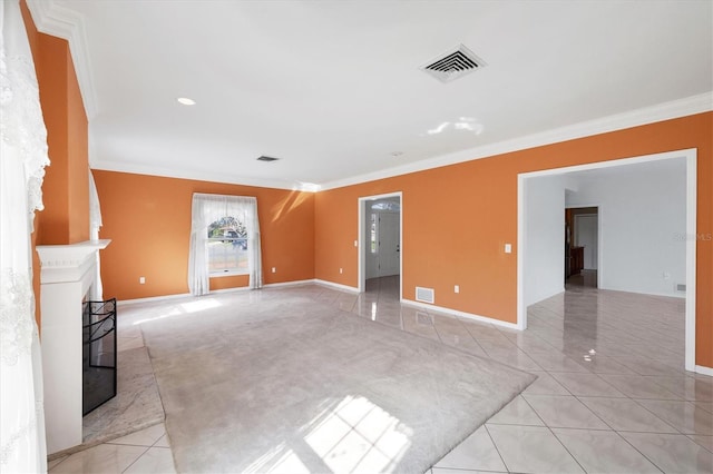 unfurnished living room with a fireplace with raised hearth, light tile patterned flooring, visible vents, and crown molding