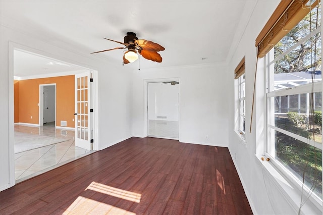 unfurnished room featuring ornamental molding, french doors, ceiling fan, and wood finished floors