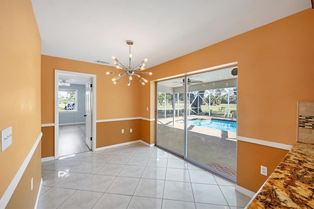 empty room with light tile patterned floors, baseboards, visible vents, a sunroom, and an inviting chandelier