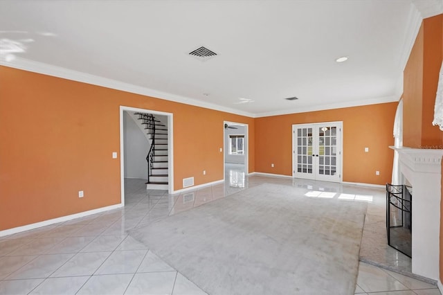 unfurnished living room with stairway, visible vents, ornamental molding, and french doors