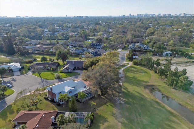 drone / aerial view featuring a water view and a residential view