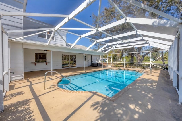 outdoor pool featuring a lanai, a patio, and a ceiling fan