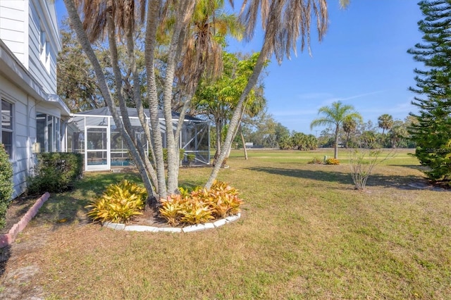 view of yard featuring a lanai