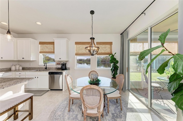 dining room featuring recessed lighting and a notable chandelier