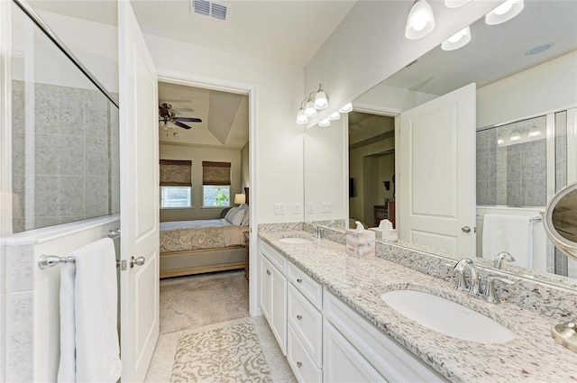 full bathroom featuring visible vents, tiled shower, tile patterned floors, ensuite bathroom, and a sink