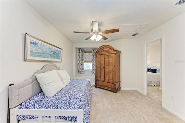 bedroom with light carpet, a ceiling fan, visible vents, and baseboards