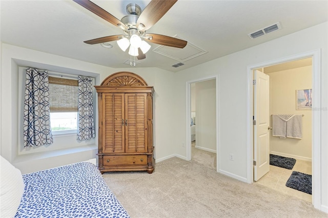 bedroom with light carpet, visible vents, and baseboards