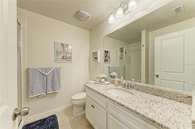 bathroom with a textured ceiling, toilet, visible vents, baseboards, and a stall shower