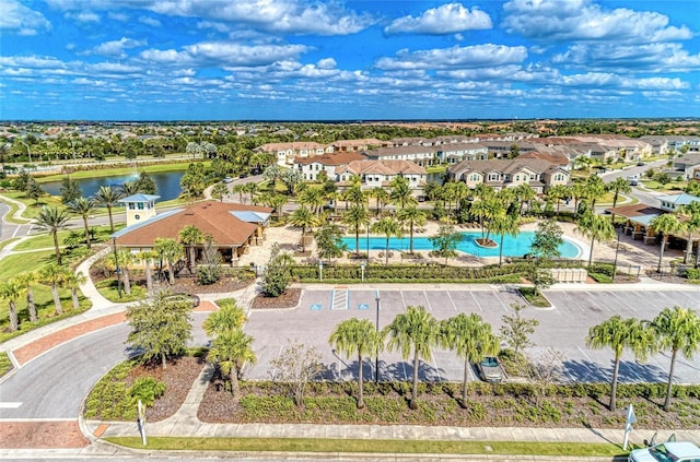 aerial view featuring a water view and a residential view