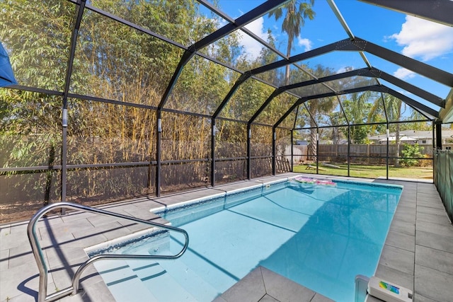 view of pool featuring a patio area, a fenced backyard, a fenced in pool, and a lanai