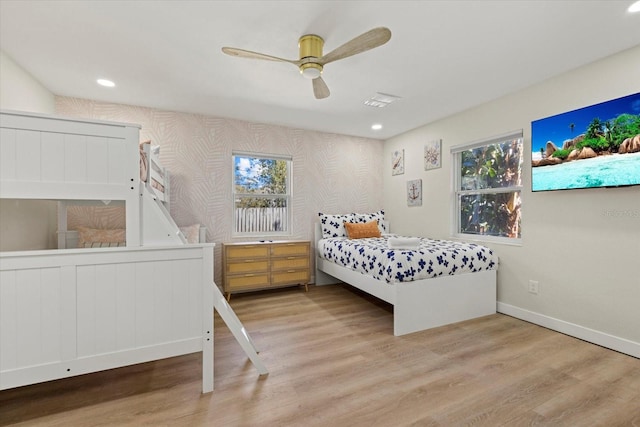 bedroom featuring wallpapered walls, visible vents, baseboards, wood finished floors, and recessed lighting