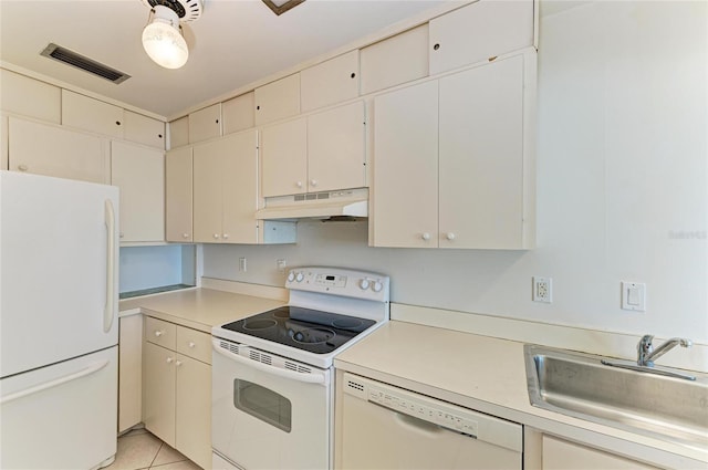 kitchen featuring light countertops, visible vents, a sink, white appliances, and under cabinet range hood