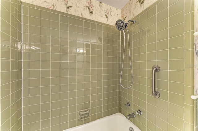 full bathroom featuring washtub / shower combination and wallpapered walls