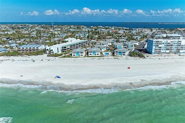 birds eye view of property featuring a water view and a view of the beach