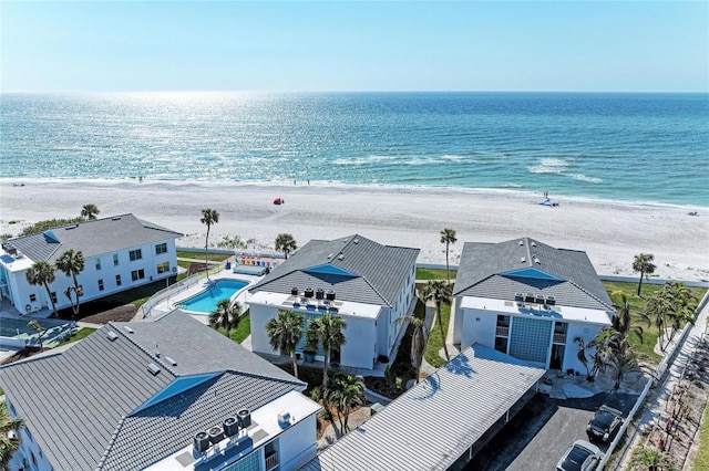 aerial view with a beach view and a water view