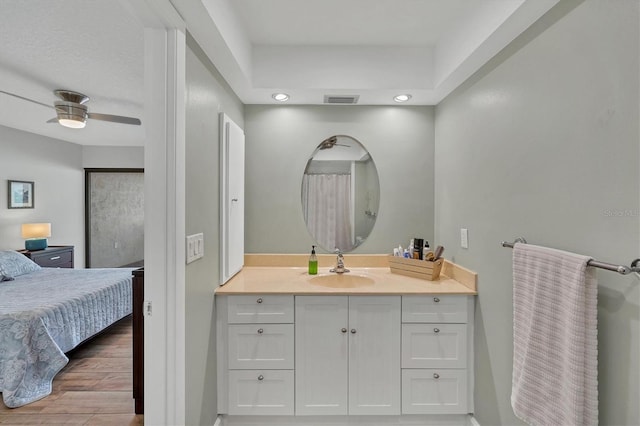 full bath with ceiling fan, visible vents, wood finished floors, and vanity