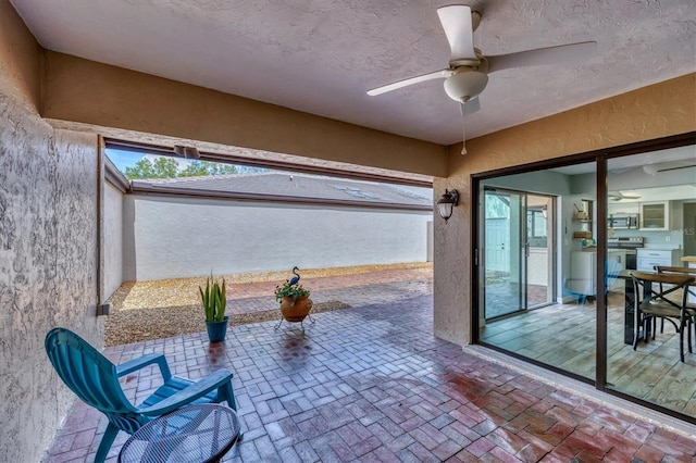 view of patio / terrace featuring ceiling fan