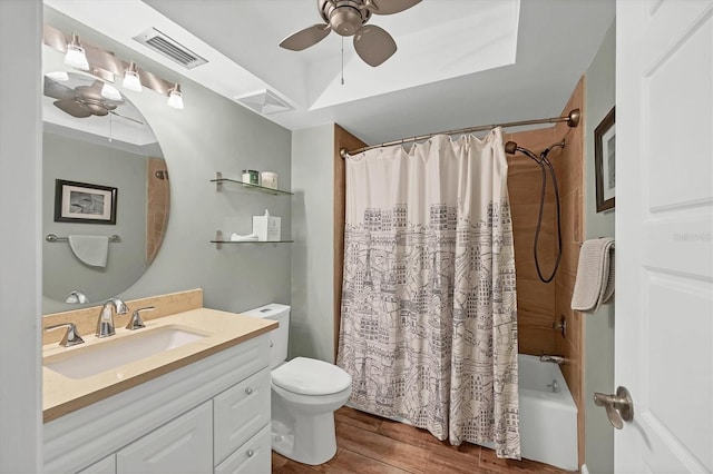 full bathroom featuring toilet, wood finished floors, a ceiling fan, visible vents, and shower / bathtub combination with curtain