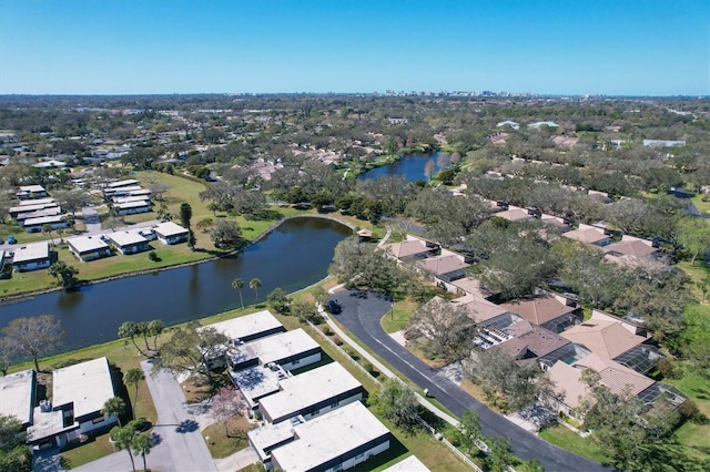 bird's eye view featuring a water view and a residential view