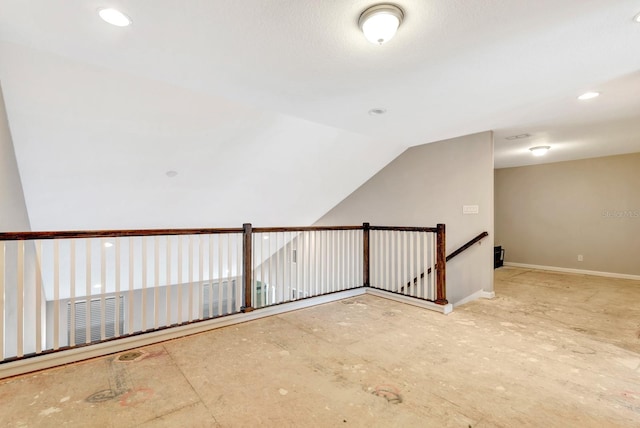 additional living space with lofted ceiling, baseboards, and recessed lighting