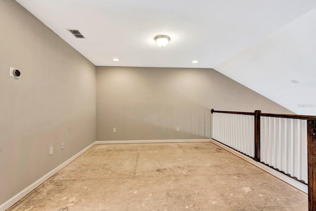 interior space featuring baseboards, visible vents, vaulted ceiling, and recessed lighting