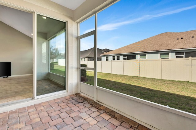 unfurnished sunroom with plenty of natural light