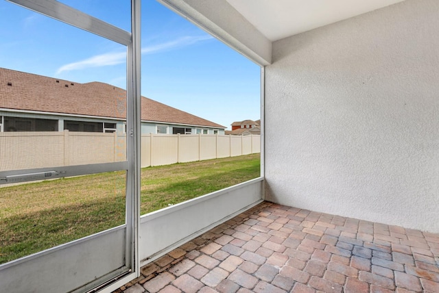 unfurnished sunroom with a wealth of natural light