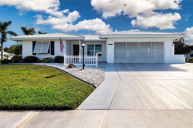 ranch-style house with an attached garage, driveway, and stucco siding