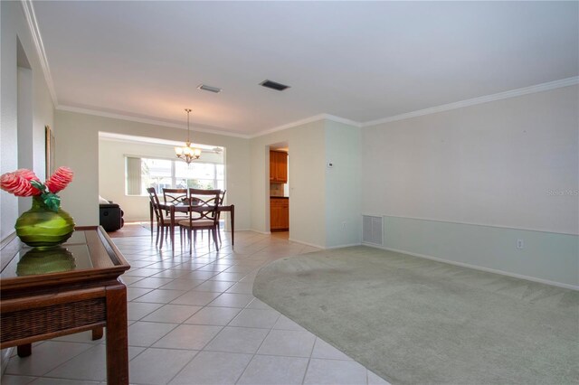 dining space featuring light tile patterned floors, crown molding, visible vents, and light colored carpet