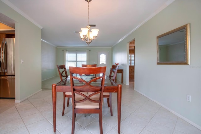 dining space with crown molding, a notable chandelier, baseboards, and light tile patterned floors