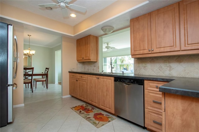 kitchen featuring light tile patterned floors, ceiling fan with notable chandelier, appliances with stainless steel finishes, tasteful backsplash, and dark countertops