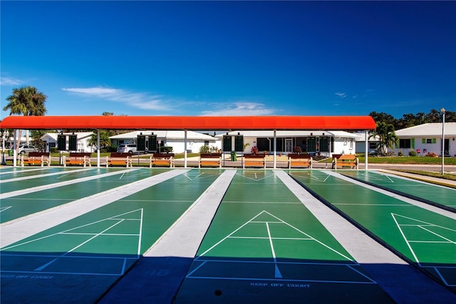 view of property's community featuring shuffleboard