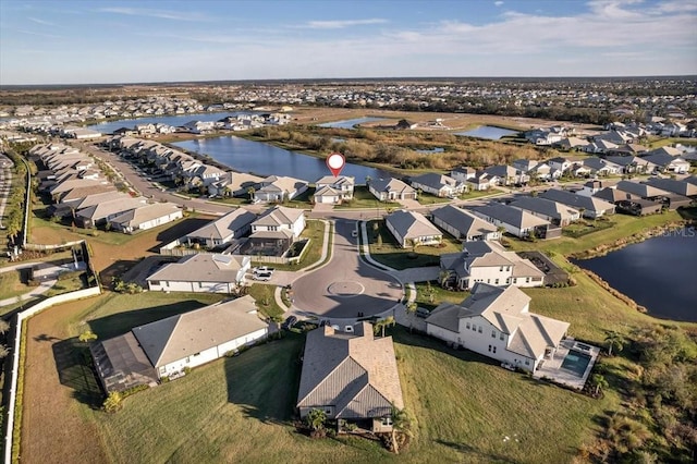 aerial view featuring a residential view and a water view