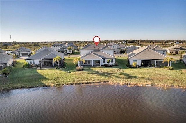 aerial view with a residential view and a water view