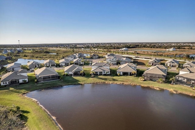 bird's eye view featuring a residential view and a water view