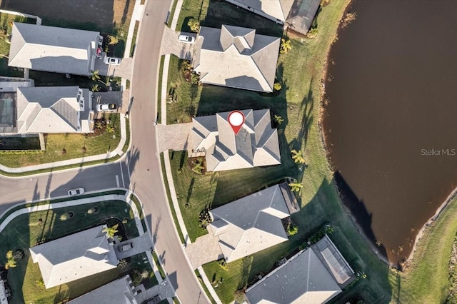 birds eye view of property with a residential view