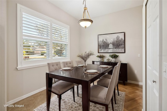 dining room featuring baseboards