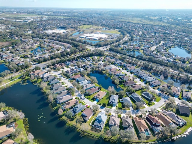 aerial view with a residential view and a water view