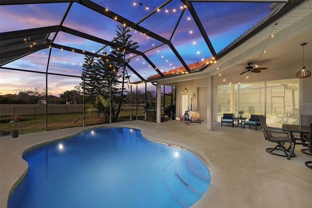 view of pool with a fenced in pool, ceiling fan, a lanai, fence, and a patio area