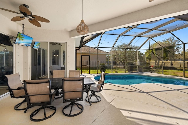 view of pool featuring a fenced in pool, a patio, fence, ceiling fan, and a lanai