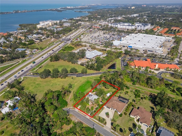 birds eye view of property featuring a water view