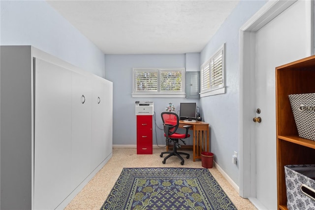 office with electric panel, baseboards, a textured ceiling, and speckled floor