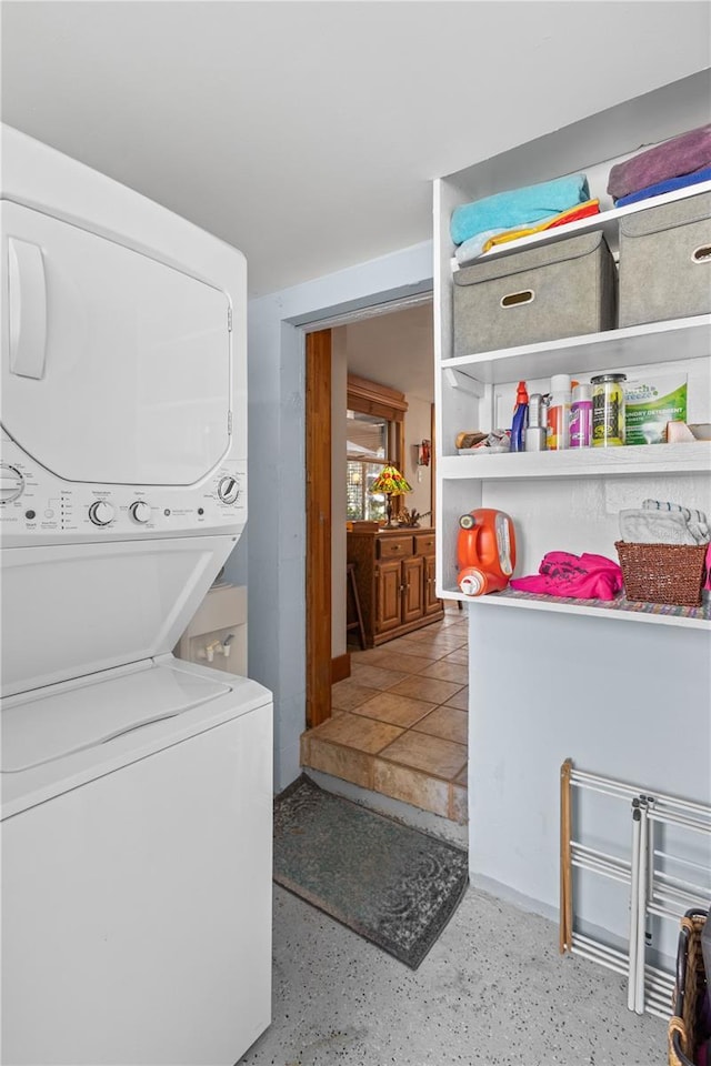 clothes washing area with stacked washer / drying machine