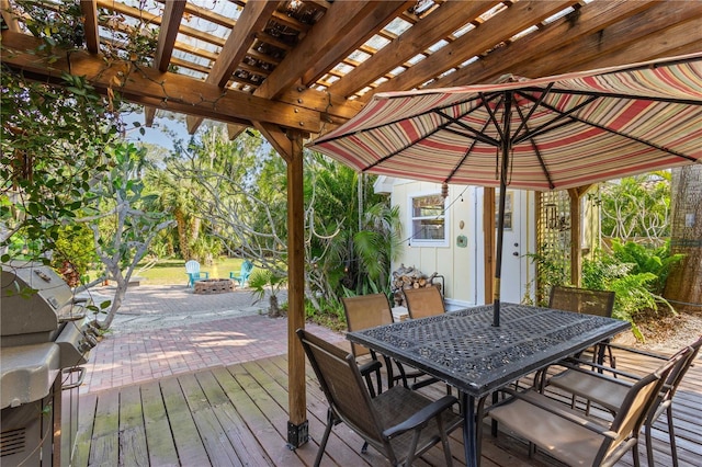 deck featuring an outdoor fire pit, a patio, a pergola, and outdoor dining space