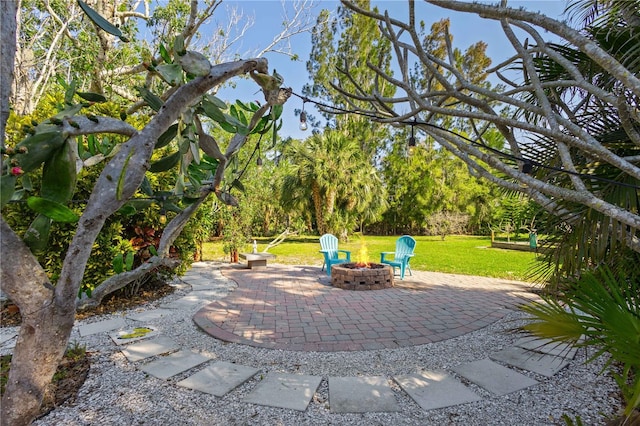 view of patio / terrace with an outdoor fire pit