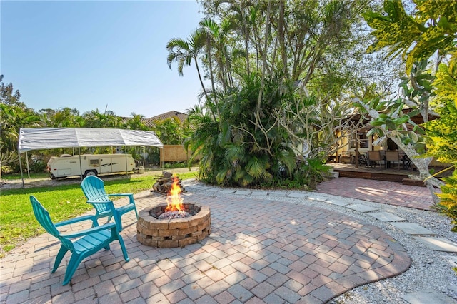 view of patio with an outdoor fire pit