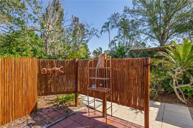 view of patio / terrace featuring fence