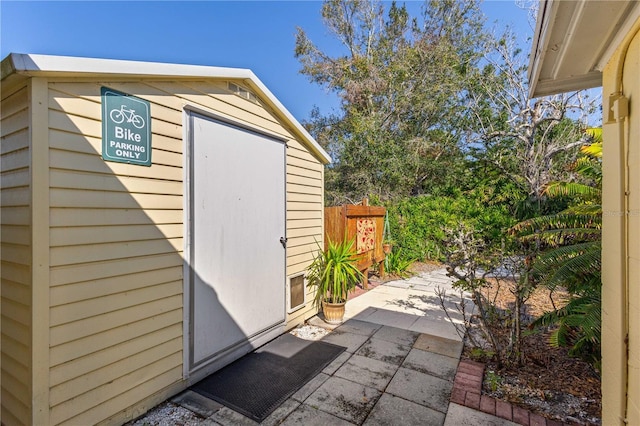 view of shed with fence